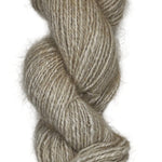 A skein of handspun angora yarn in a cream natural color