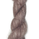 Skein of hand dyed suri silk yarn color dusty rose