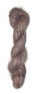 Skein of hand dyed suri silk yarn color dusty rose