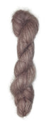 Skein of hand dyed suri silk yarn color dusty rose