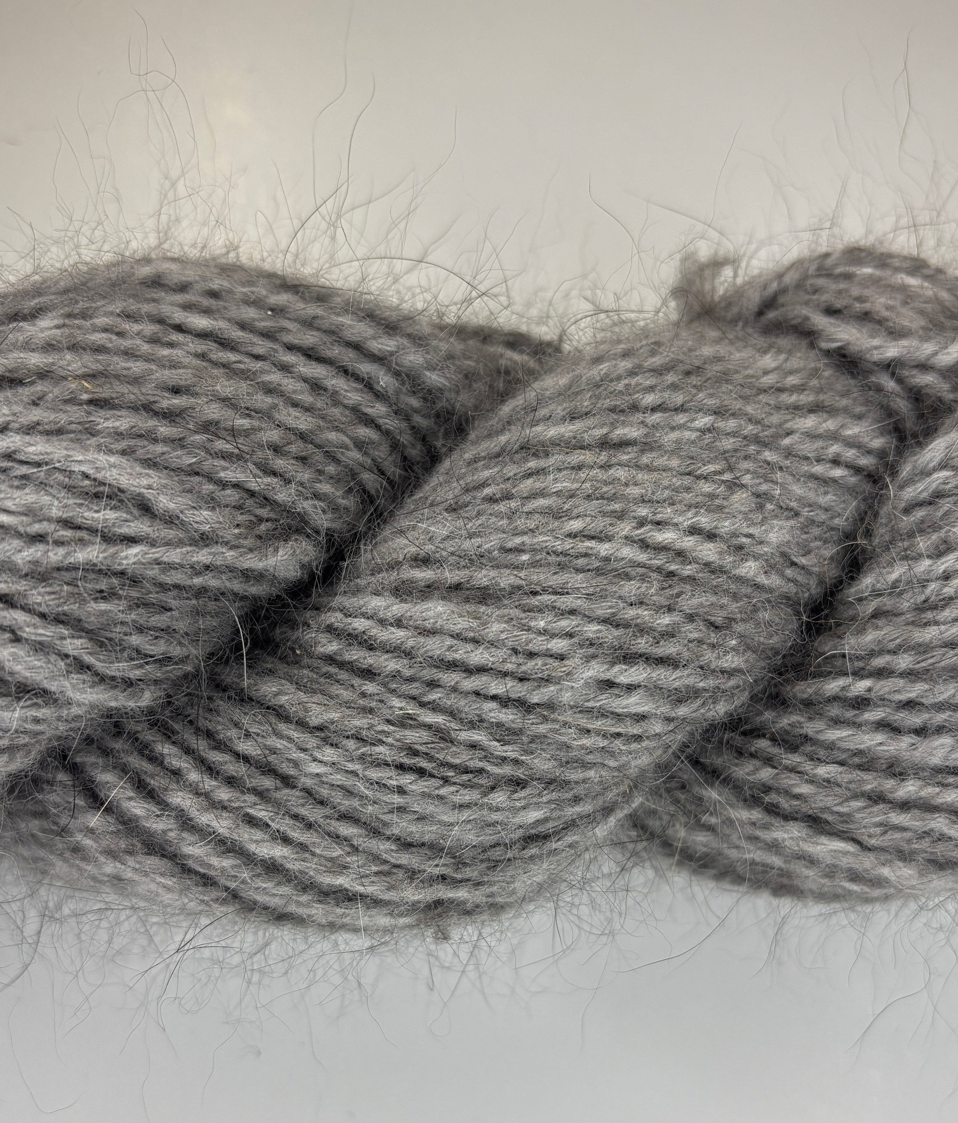 Handspun skein of Angora and Wool Yarn color grey