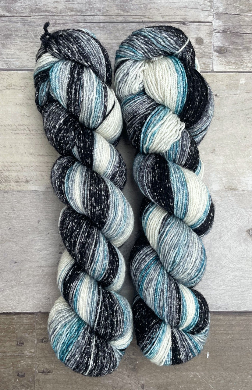 Polka Dot Sheep Striata Gradient yarn color teal, black, and white