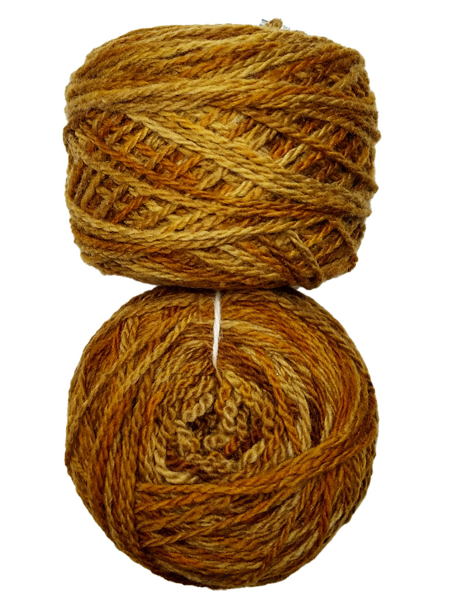 Photo of two balls of light brown Tronstad yarn