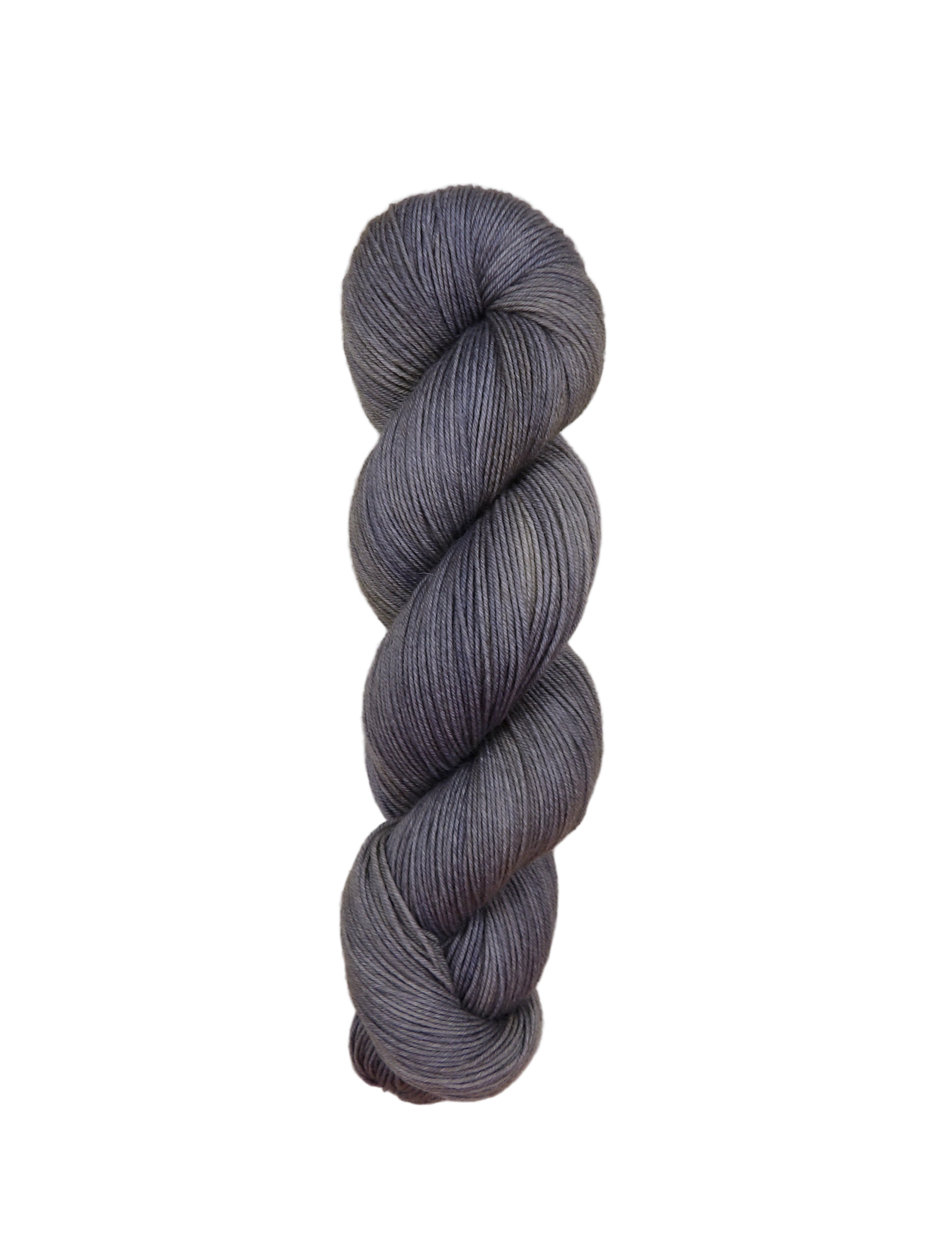 Gray skein of yarn on a light wooden surface