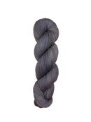 Gray skein of yarn on a light wooden surface
