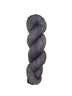 Gray skein of yarn on a light wooden surface