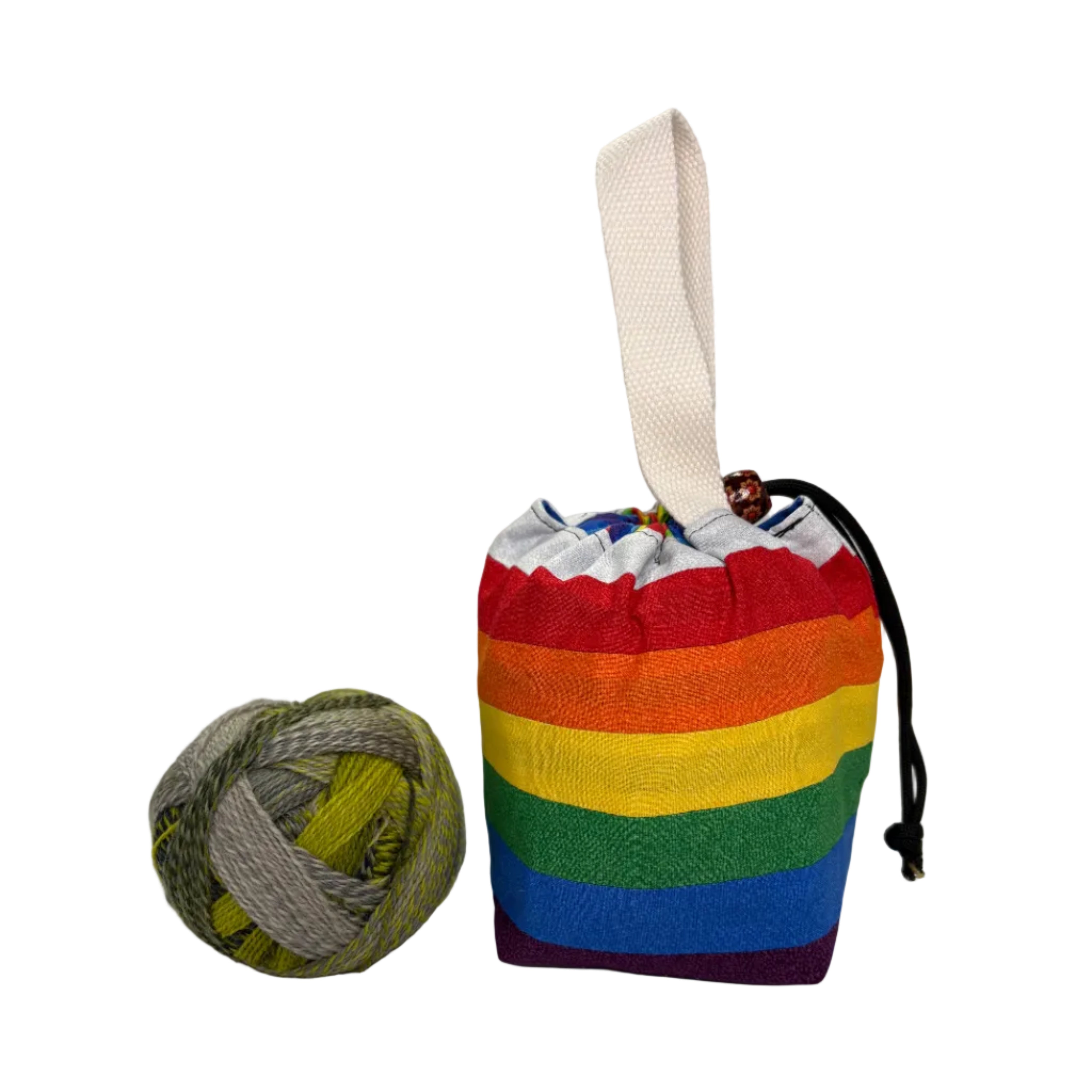 Colorful drawstring pouch with rainbow pattern on a white surface