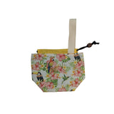 Floral-patterned pouch with toucan and parrot design on a plain background