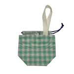 A small fabric drawstring pouch with a teal and white gingham pattern, a white fabric loop handle, and a purple drawstring cord