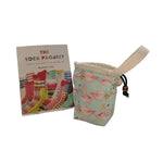 Flamingo-patterned pouch with a book titled 'The Sock Project' on a white surface.