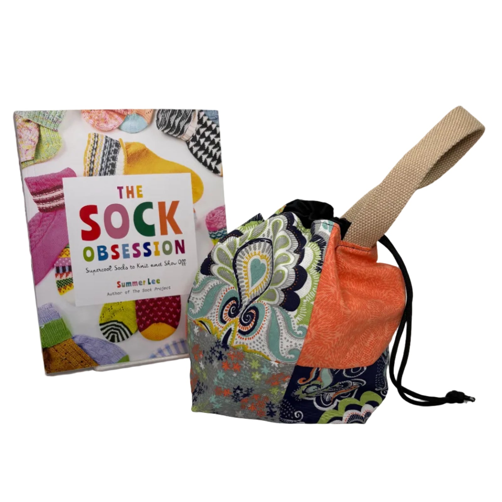 Colorful fabric bag with drawstring and a book titled 'The Sock Obsession' on a white surface.