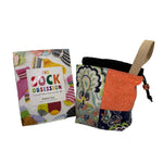 Colorful fabric bag with a wrist strap and book titled 'The Sock Obsession' on a white background