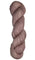 Skein of hand dyed fingering weight yarn in the color dusty rose