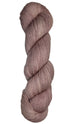 Skein of hand dyed fingering weight yarn in the color dusty rose
