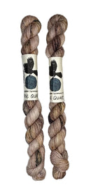 Two mini skeins of wool yarn hand dyed in Wyoming in the color pink brown speckles