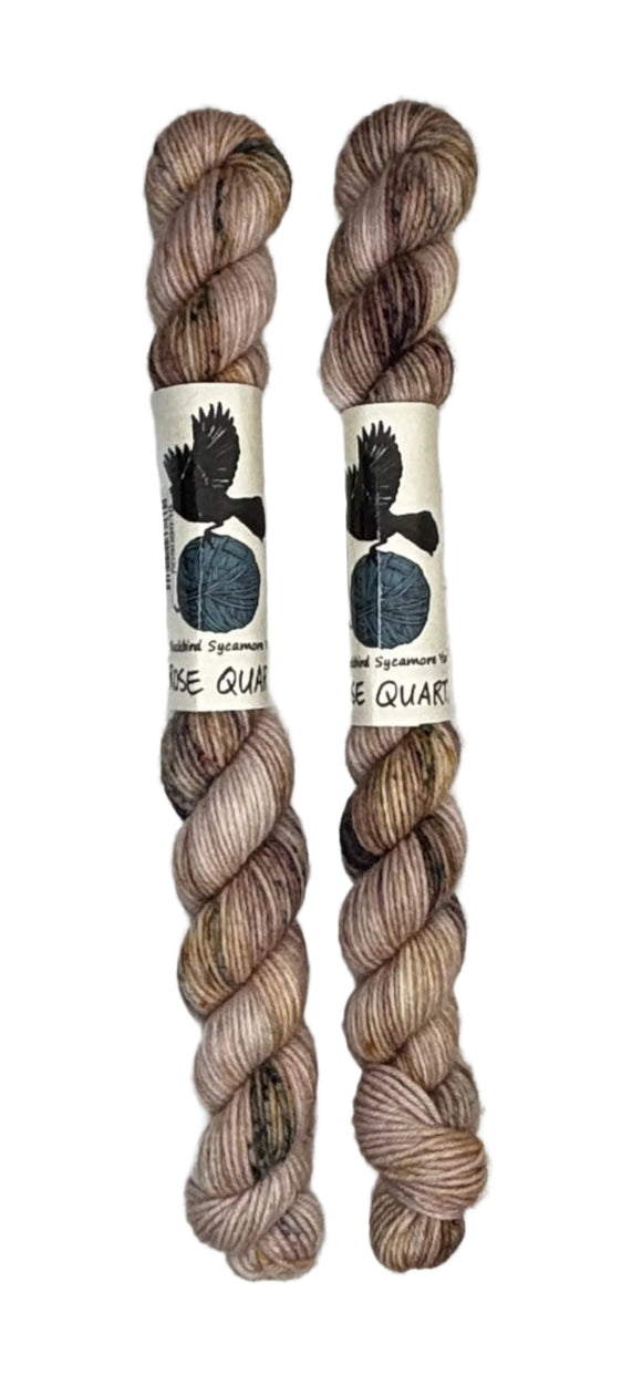 Two mini skeins of wool yarn hand dyed in Wyoming in the color pink brown speckles