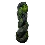 Green and gray skein of yarn on a white background