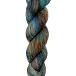 A skein of hand-dyed fingering/sock yarn color grey blue orange brown red black speckles