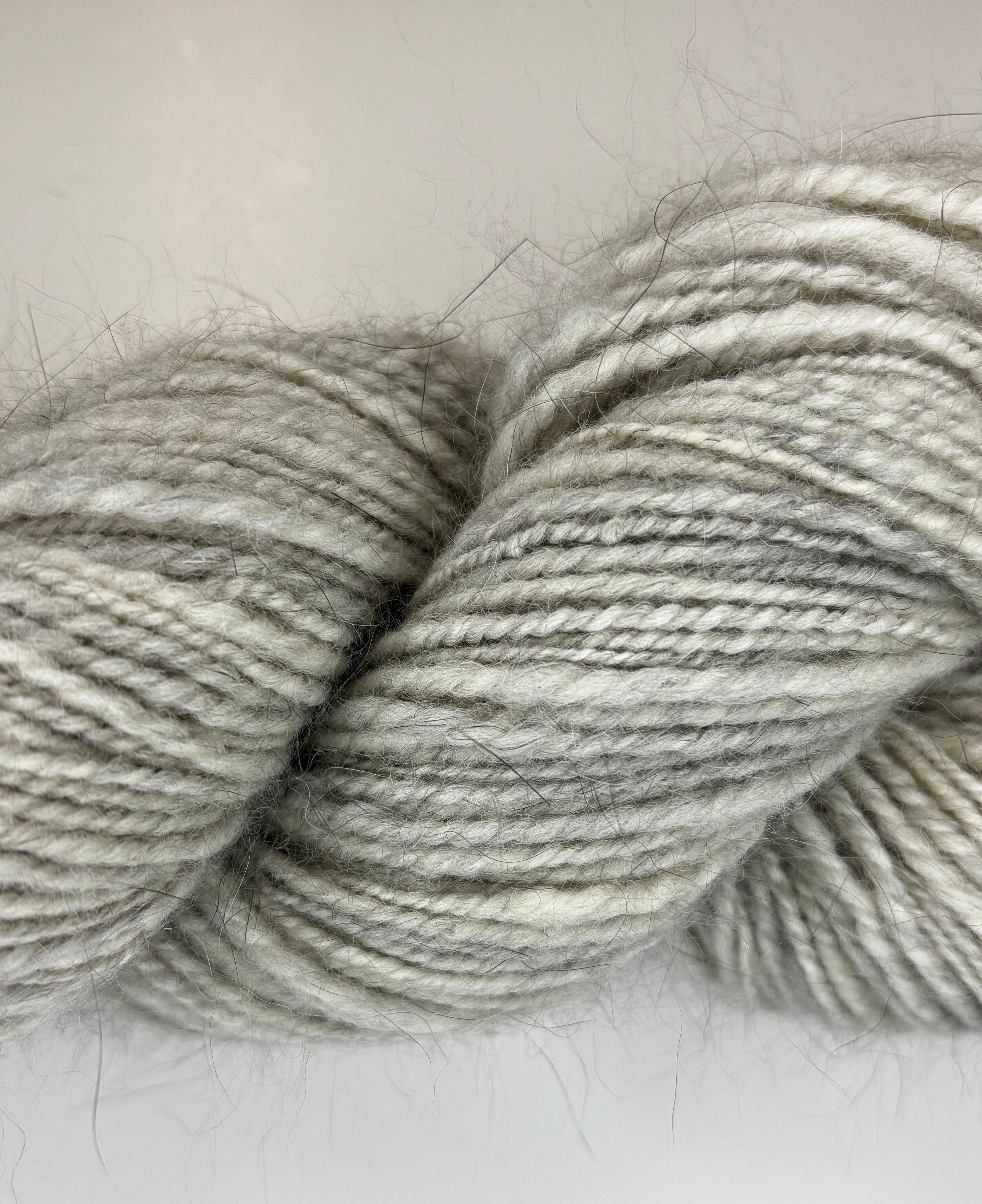 Handspun skein of Angora and Wool Yarn color grey and white