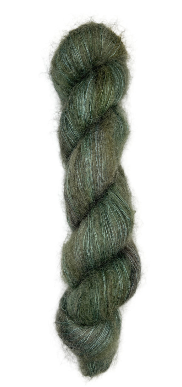 Hand dyed skein of silk mohair in the colors green brown black