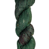 Skein of hand-dyed BFL Tweed wool yarn in the color green and streaks of red
