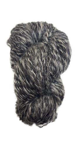 Skein of handspun yarn in the colors black and grey