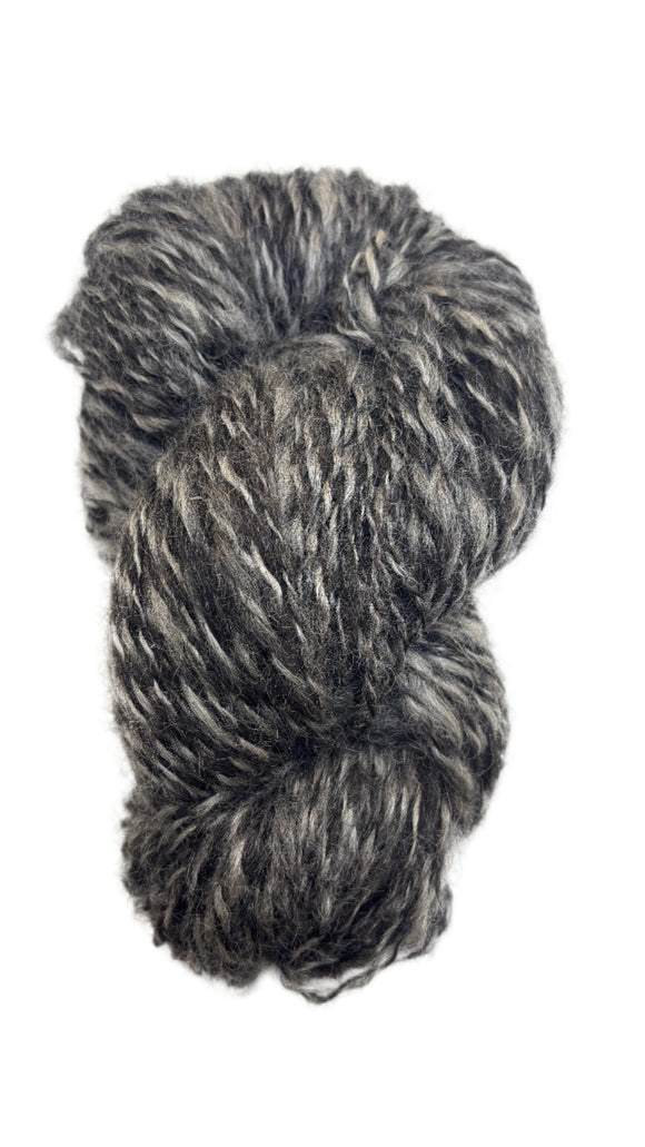 Skein of handspun yarn in the colors black and grey