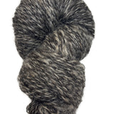 Gray and black skein of yarn on a white background