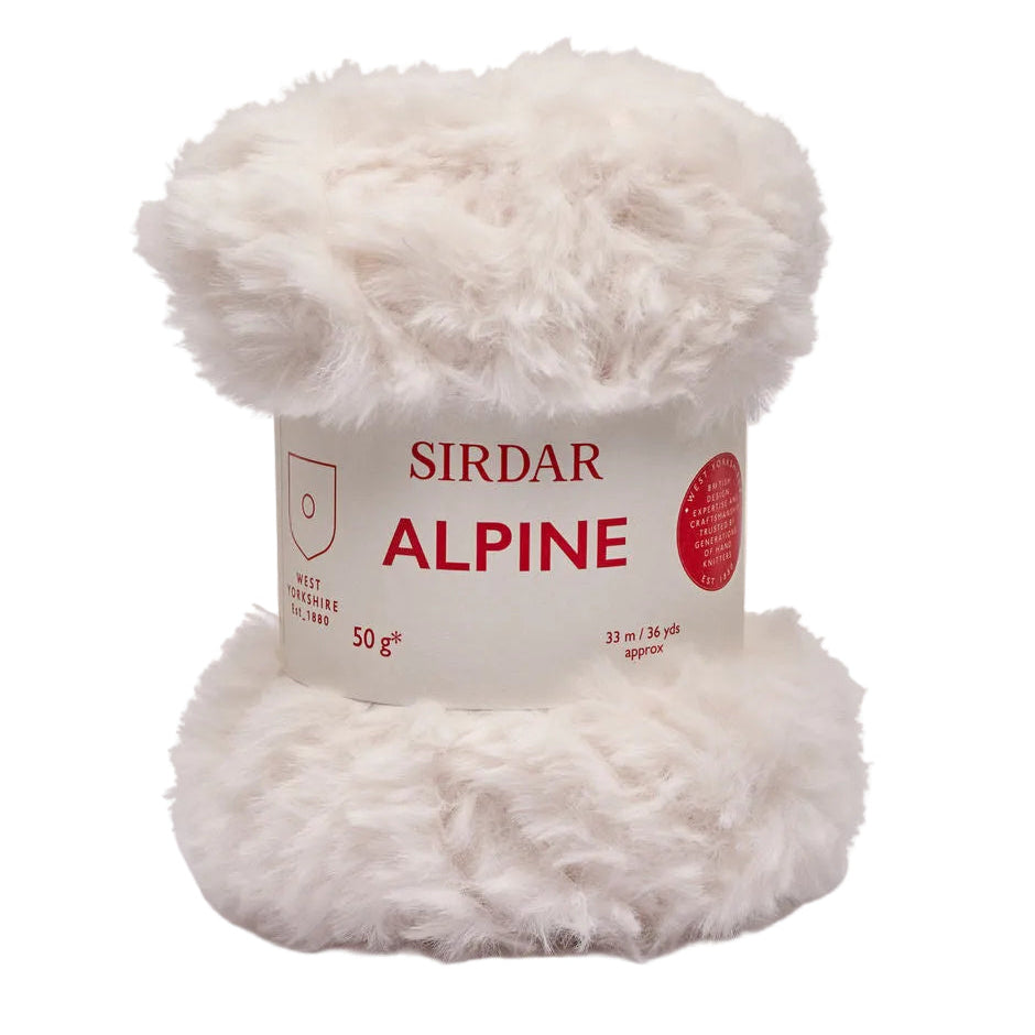 Ball of white yarn with Sirdar Alpine label on a light beige background