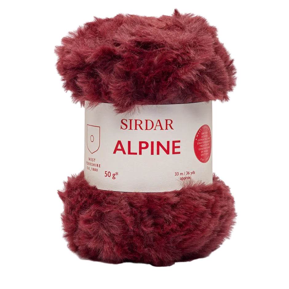 Red ball of yarn with 'Sirdar Alpine' label on a light beige background