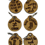 Small wooden stitch markers with decorative engraving