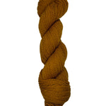 Brown skein of mountain meadow wool yarn on a white background