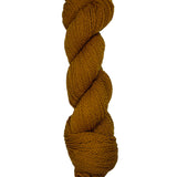 Brown skein of mountain meadow wool yarn on a white background