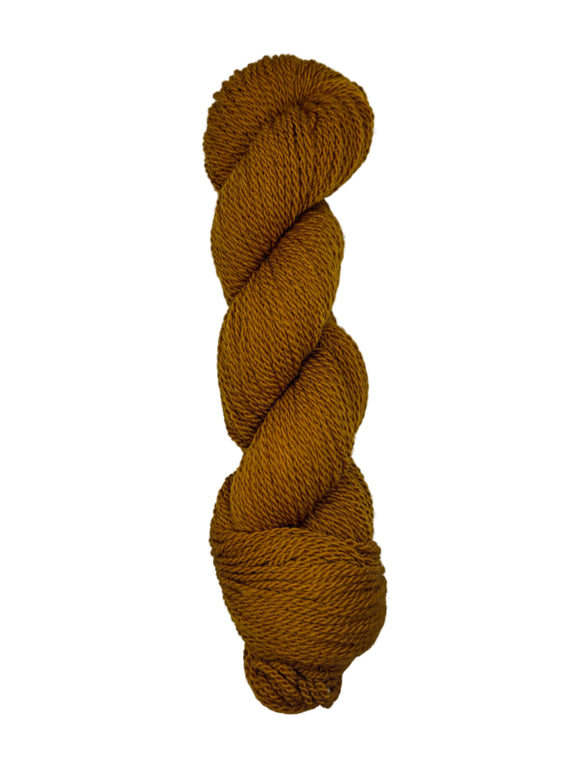 Brown skein of mountain meadow wool yarn on a white background
