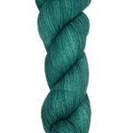 Skein of hand dyed fingering weight yarn in the color spruce green