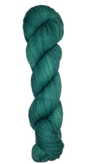 Skein of hand dyed fingering weight yarn in the color spruce green
