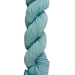 Light Blue skein of mountain meadow wool yarn on a white background