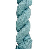Light Blue skein of mountain meadow wool yarn on a white background