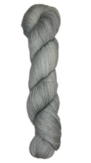 Skein of hand dyed fingering weight yarn in the color grey
