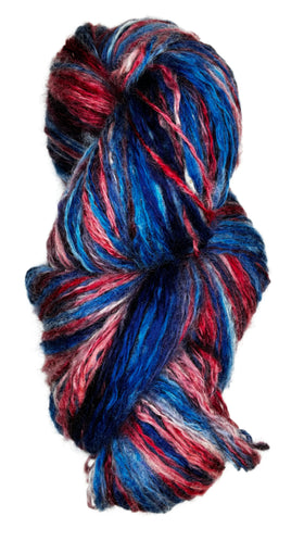 Skein of handpainted handpun wool yarn from Tronstad Ranch in Wyoming in the colors blue red white