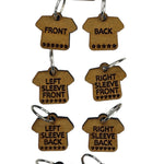 Small wooden stitch markers with engraved words