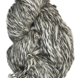Skein of handspun yarn from Tronstad Ranch in Wyoming in the color natural grey and white