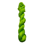 Braided green yarn on a white background