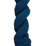 Teal skein of mountain meadow wool yarn on a white background