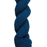 Teal skein of mountain meadow wool yarn on a white background
