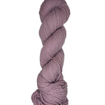 Light purple skein of mountain meadow wool yarn on a white background