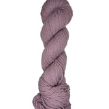 Light purple skein of mountain meadow wool yarn on a white background