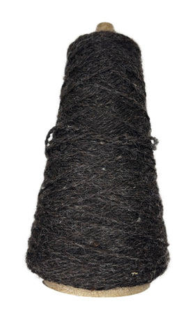A cone of handspun worsted weight wool in the color natural brown