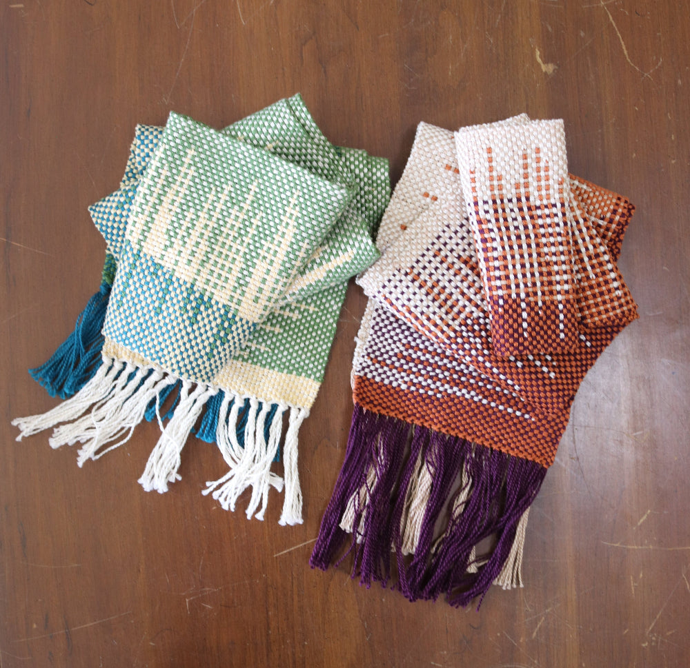 Two Clasped Warp and Weft woven scarves with squared geometric patterns