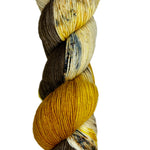 BROWN AND GOLD YARN ON A SOCK BASE